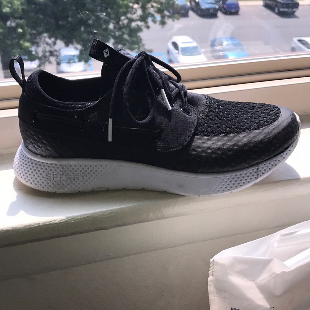 Black and white Sperry sneakers.